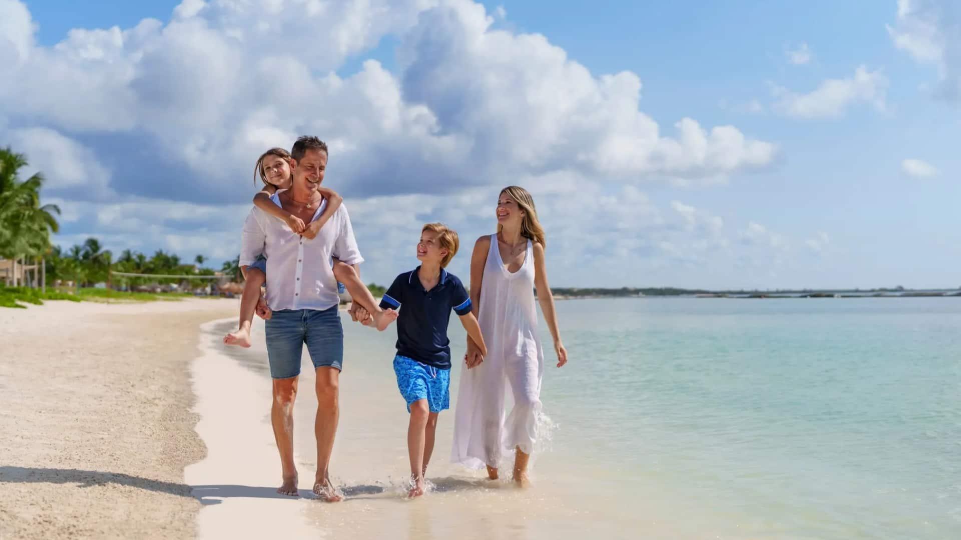 Family walking along a beach